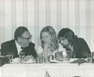 Henry Kissinger, Faye Dunaway and husband Peter Wolf at a party