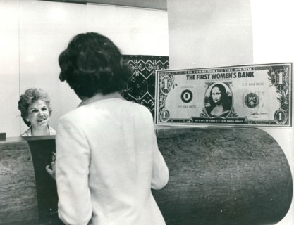A teller takes care of a customer at the Women's Bank of the State of New York