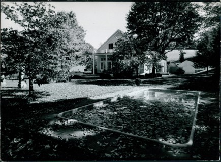 View of the swimming pool and yard at Jackie Onassis' home in Peapack, New Jersey