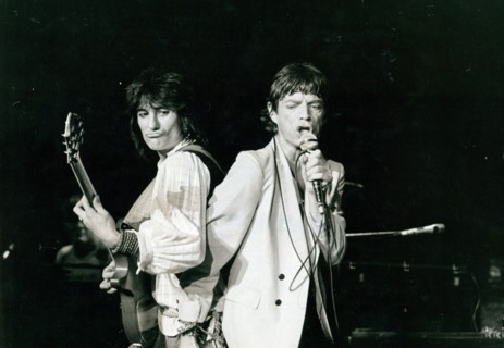 Ron Wood and Mick Jagger performing at a Rolling Stones concert