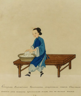 Northern Chinese peasant woman washing a dress