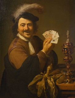Player with a deck of cards and a cup