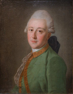 Portrait of a young man in a green coat