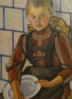 Portrait of a girl against a Tile Stove