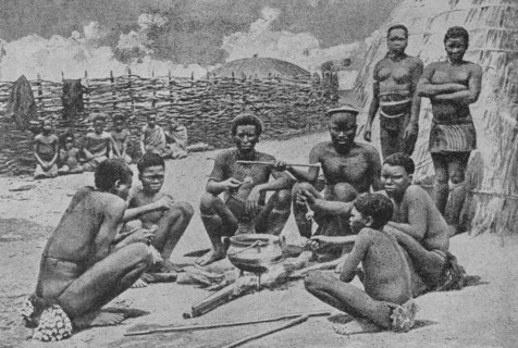 KwaZulu-Natal, South Africa. Men of the Hlubi tribe eating. Photogravure. ""La conquista de