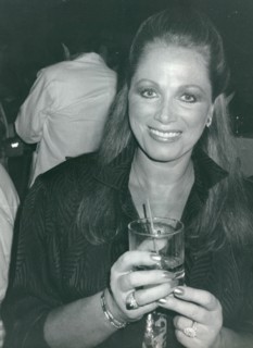 British author Jackie Collins with a drink