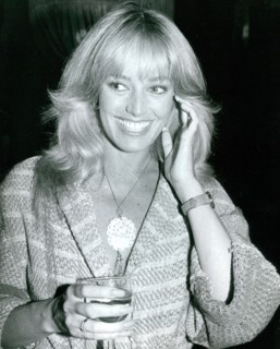 Susan Anton with a drink
