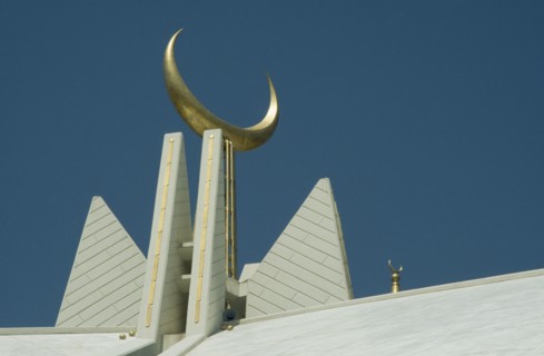 PAKISTAN, Islamabad, Faisal Mosque roof detail with golden crescent moon symbol.