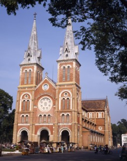 VIETNAM, South, Ho Chi Minh , "Notre Dame Cathedral,twin spires,rose window,street market,people "