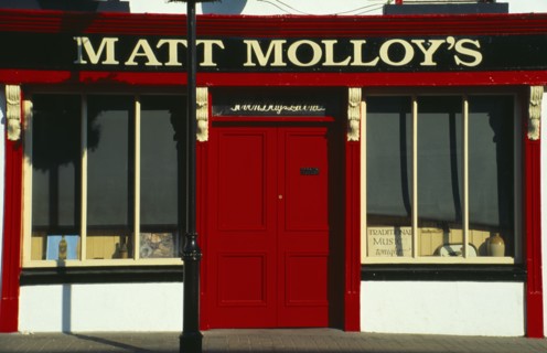 IRELAND, County Mayo, Westport, Matt Malloys traditional Pub front with bright red door