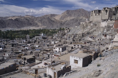 INDIA, Ladakh, Leh, Hillside Palace overlooking the town surrounded by mountainous terrain