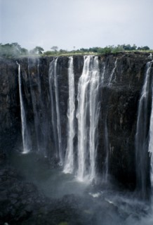ZIMBABWE, Waterfall, Zambezi River Victoria Falls. Waterfall plummeting 355 feet over a sheer cliff