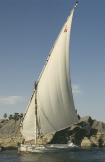 EGYPT, Aswan, Single felucca on the River Nile