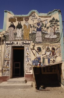 EGYPT, Luxor, House on West Bank of the Nile decorated with both Muslim figures and hieroglyphics