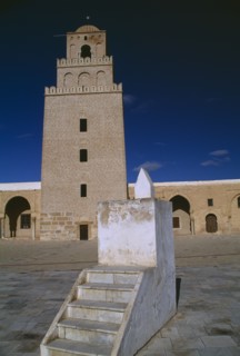 TUNISIA, Kairouan, Mosque and courtyard with minaret behind and lecturn in the foreground
