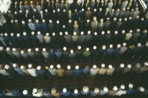 CHINA, Gansu Province, Lanzhou, View looking down on rows of praying Muslims in a Mosque on