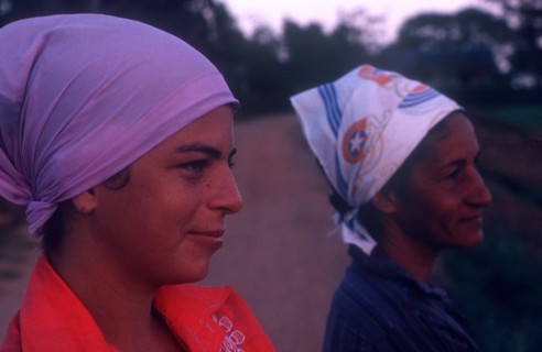 CUBA, Pinar del Rio, Close up of two women wearing head scarfs looking off to the right