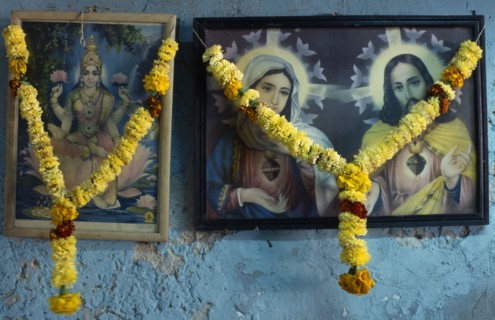 INDIA, Religion, Christian / Hindu, Framed pictures of Hindu and Christian iconography hung with