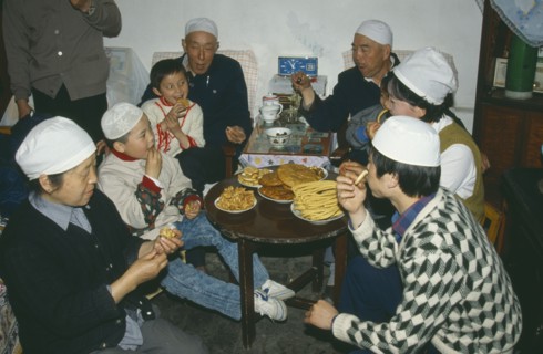 CHINA, Gansu Province, Lanzhou, Muslim family celebrating the end of Ramadan.
