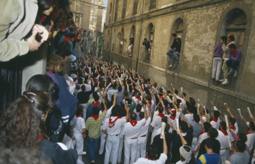 SPAIN, Navarra, Pamplona , San Fermin Bull Run Festival prayers in a narrow street  before bull run