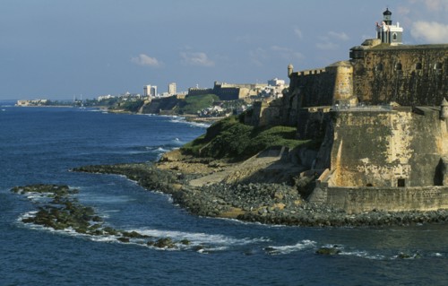 WEST INDIES, Puerto Rico, San Juan, View along San Juan coastline with fort and old city walls.