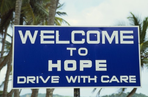 WEST INDIES, Tobago, Hope, Blue and white roadsign outside village reading Welcome To Hope Drive