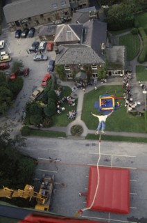 SPORT, Air, Bungee Jumping, "View from cage over falling bungee jumper, inflated safety mat and