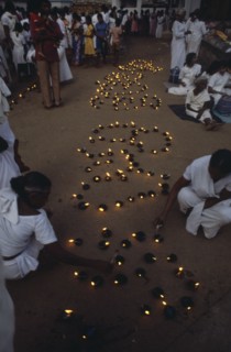 SRI LANKA, Anuradhapura, Lighting lamps during Wessac.