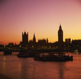 ENGLAND, London, Houses of Parliament & Big Ben at sunset; orange sky.