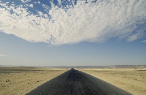 EGYPT, Western Desert, near Farafra Oasis, Tarmac road through desert