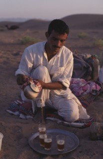EGYPT, Sahara Desert , Berber guide pouring tea