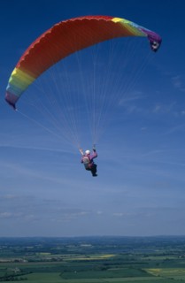10037036 SPORT Air Paragliding Paraglider with multicoloured chute.