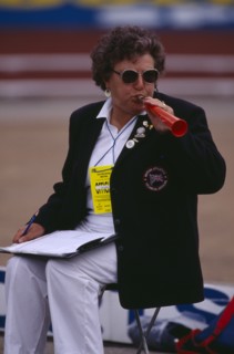 10039037 SPORT Athletics Javelin Female official blowing horn to warn that competitor is about to throw javelin.