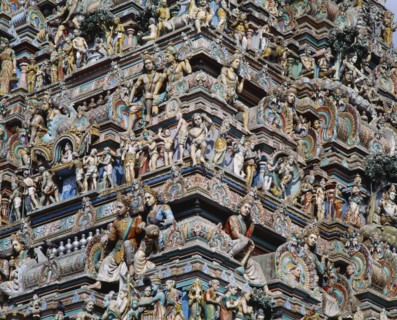 INDIA, Tamil Nadu, Madras, Kapaleeshwara Temple.  Detail of Dravidian style gopuram or pyramidal