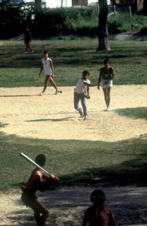CUBA, Pinar del Rio, Young men playing a game of baseball