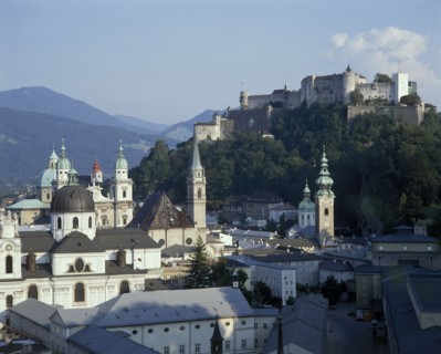 AUSTRIA, Salzburg Province, Salzburg, Hohensalzburg Fortress on wooded hill beyond the city