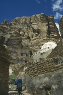 YEMEN, Thula, "Houses in hills, one white domed. Two women walking up steps"