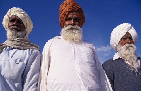 INDIA, Punjab , Amritsar, "Three elderly Sikh men, head and shoulders portrait from low angle