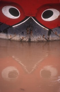 VIETNAM, My Tho, Detail of boat with traditional painted decoration depicting a pair of guarding