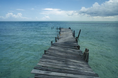 CUBA, Ciego De Avila, Cayo Guillermo, Derelict wooden jetty leading out to sea