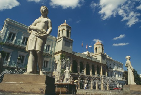 WEST INDIES, Puerto Rico, San Juan, Plaza Des Armas with statues around fountain in front of The