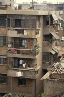 CHINA, Shaanxi, Xian, Housing block with potted plants and drying clothes on the balconies.