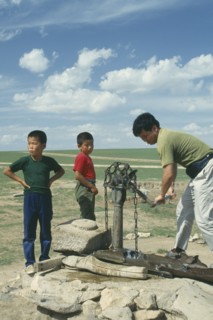 MONGOLIA, Agriculture, Children and a man using well and pump