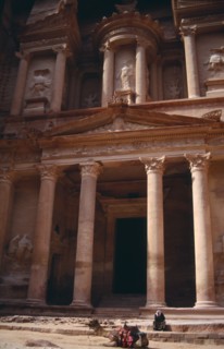 JORDAN, Petra, The Treasury entrance with camel sitting in foreground