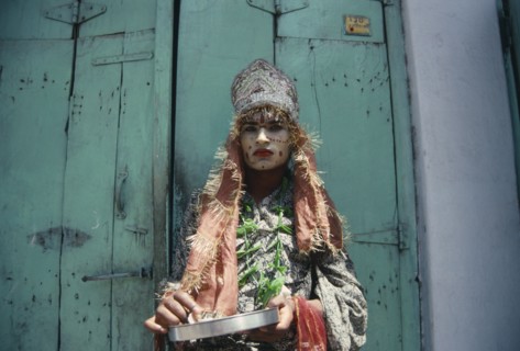 INDIA, Rajasthan, Udaipur , "Hermaphrodite with painted face and head-dress.  Ambiguous male