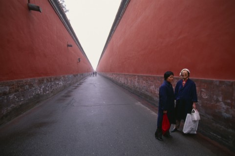 CHINA, Beijing , Imperial Palace, Two women standing between red walls