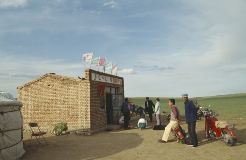 MONGOLIA, Agriculture, Sheep, Mongolians gathering for sheep work with motorbikes and bicycles