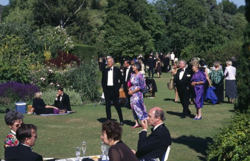 ENGLAND,  East Sussex, Glyndebourne, Opera attendees enjoying picnics in the gardens during