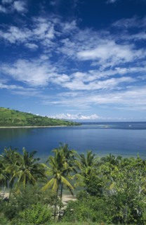 INDONESIA, Lombok , Sengiggi Area, Coastline north of Senggigi with Mount Agung on Bali visible in