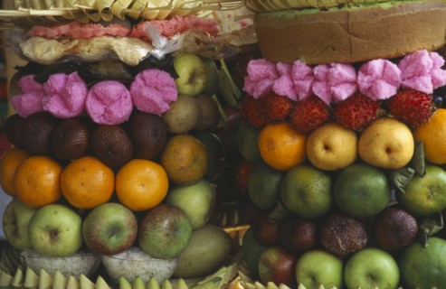 INDONESIA, Bali, Ubud, Temple offerings of fruit arrangements